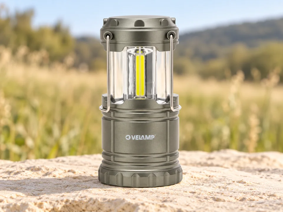 Velamp — lanterne extractible anthracite — Une lanterne déployée avec colonne centrale jaune et anses métalliques rabattues.